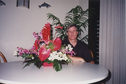 Don with exotic flowers